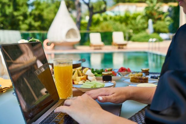 laptop by the swimming pool