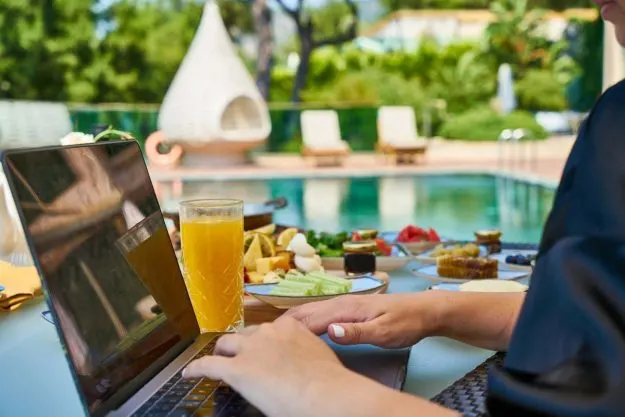laptop by the swimming pool